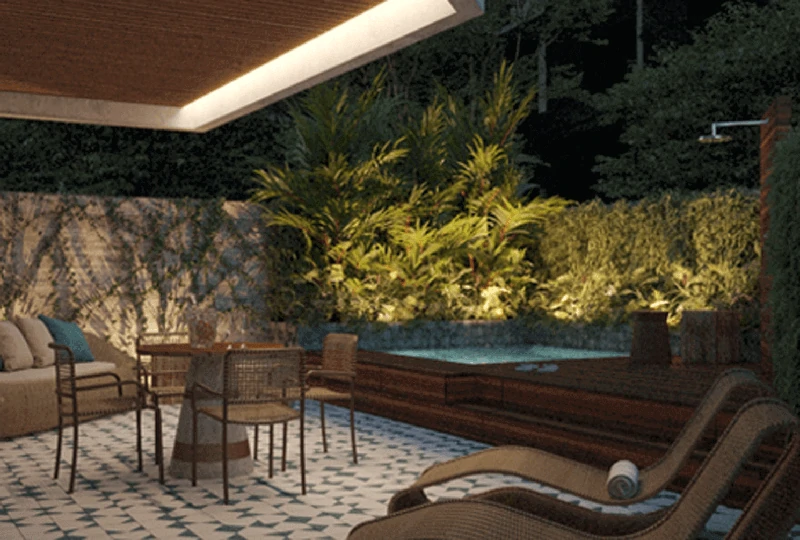 Piscina e terraço à noite do Villa Thereza